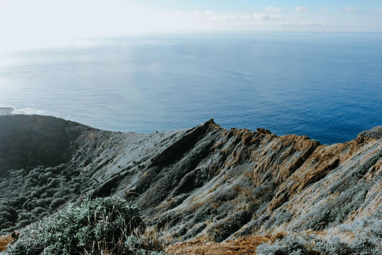 a view of a mountain, with some water on it