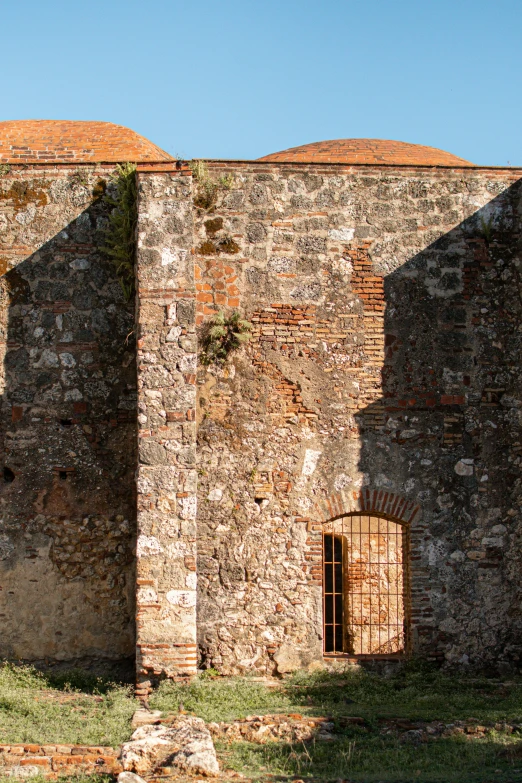 a large brick building with a door and brick wall