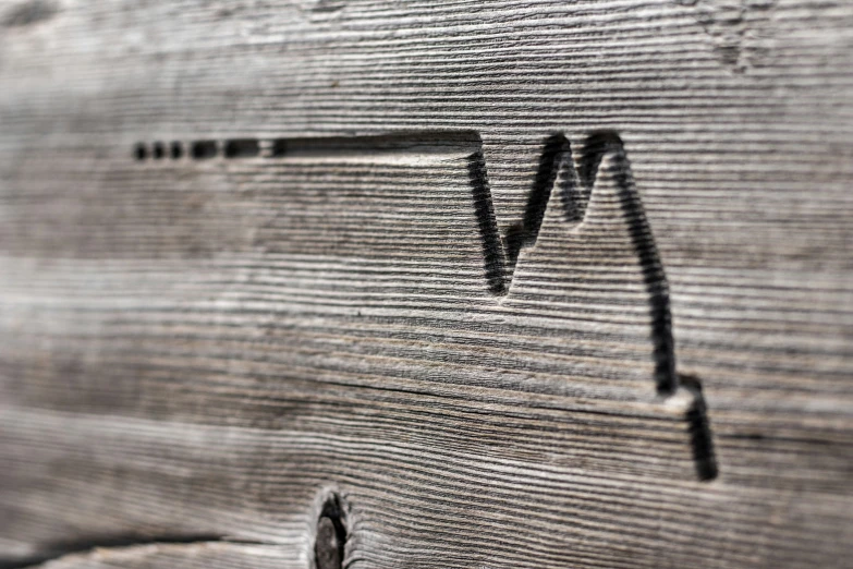 a close up of a wooden paneled surface with lines