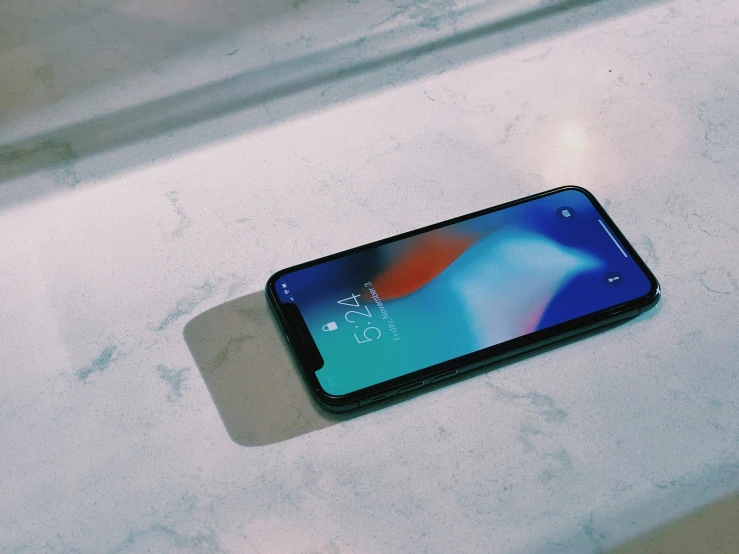 an iphone is sitting on the counter at a restuarant