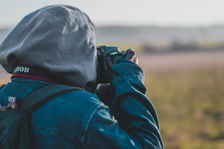 a man taking a po of a field