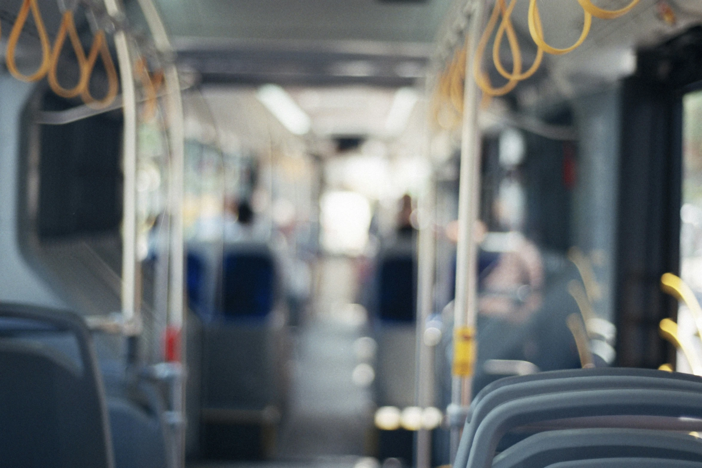 the seats in this bus are empty during the day