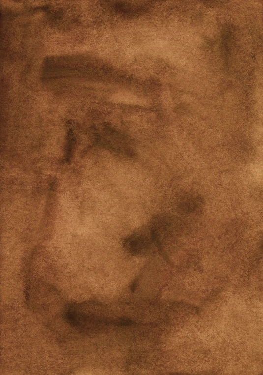 the view of a face on top of a sand covered ground