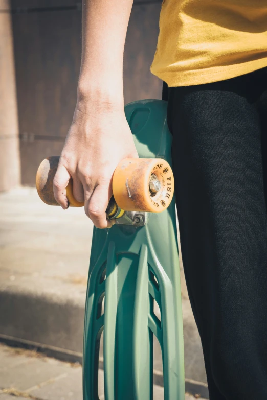 a person holding a bike handle with one hand