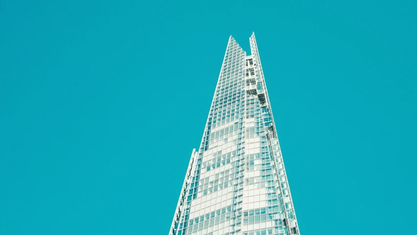 a very tall building with some windows and the sky