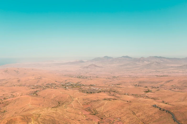 a valley view from an airplane looking over a large landscape