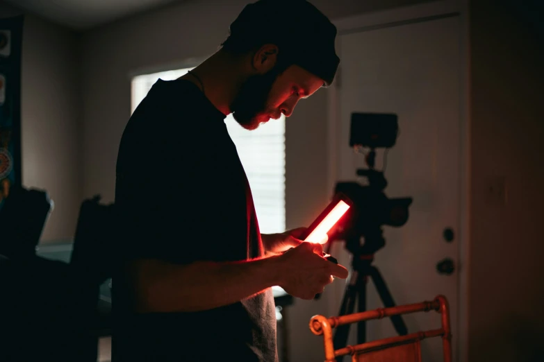 man holding a camera in front of him