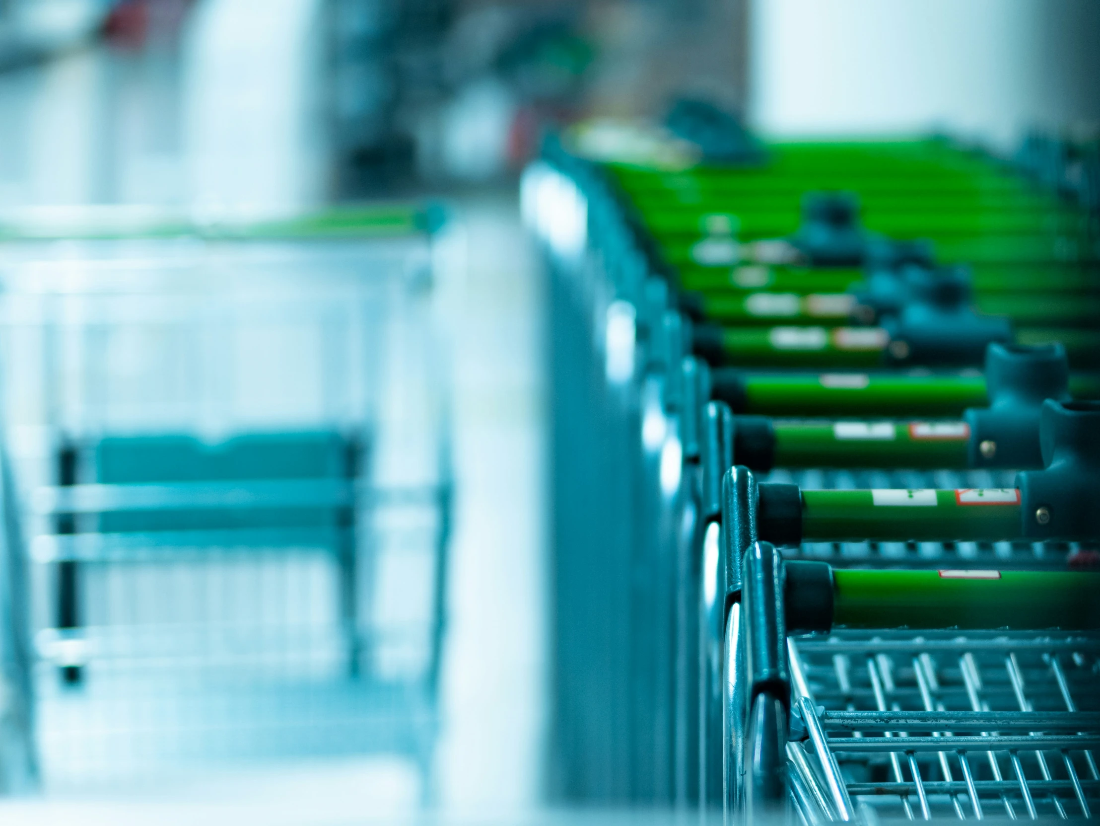 a shopping cart full of many green items