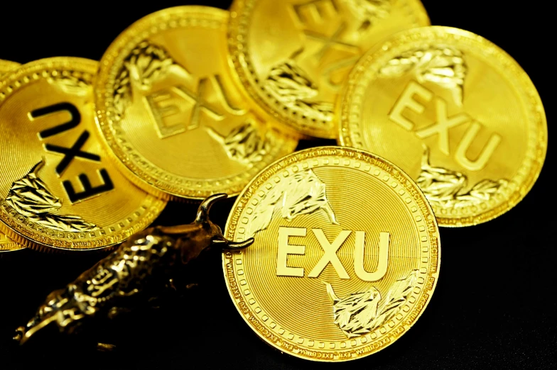 gold exu coins lying next to each other