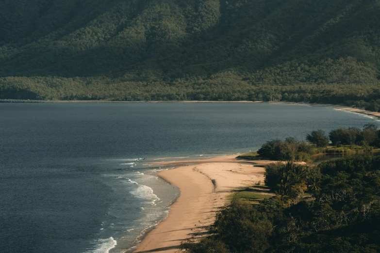 a view from above of a beach and mountain range