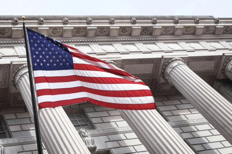 an american flag is on the side of a building