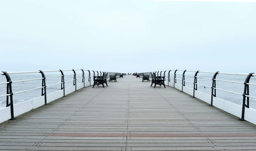 the docks at a park filled with benches