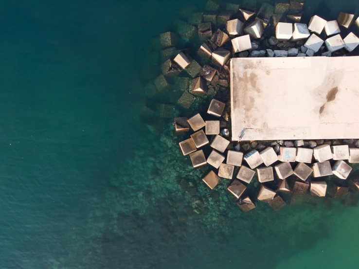 a large cement block that has been set into the water