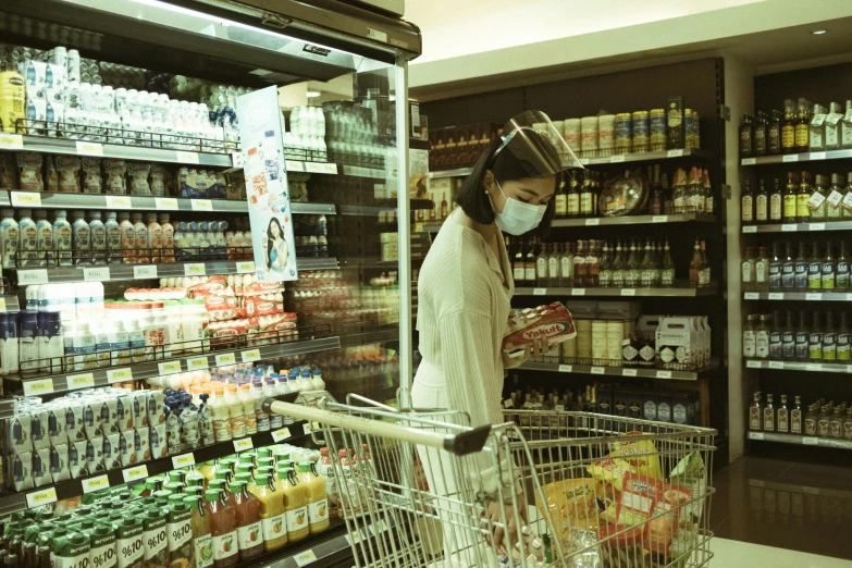 a man in a mask is shopping for food