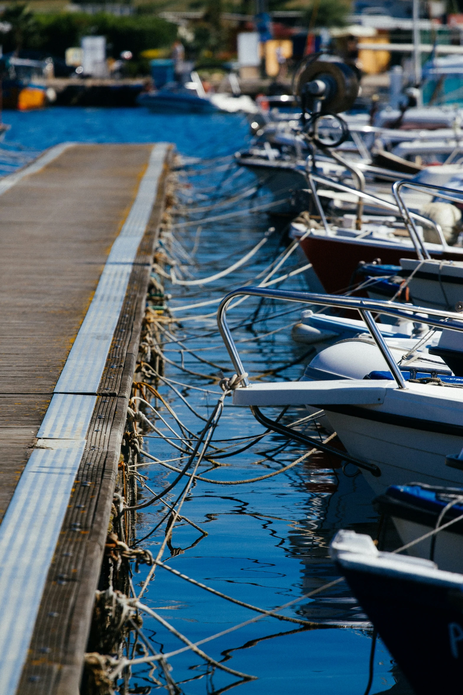 several small boats are parked next to each other