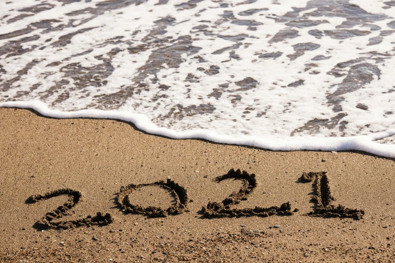 a po of the year 2009 is written on the beach