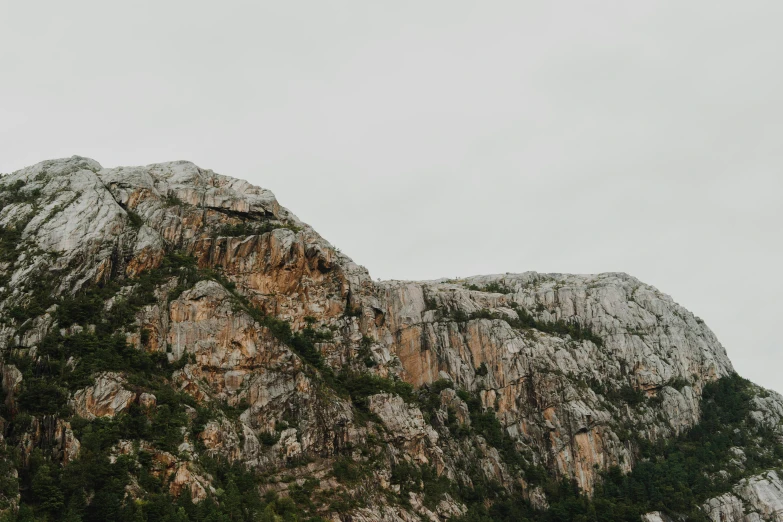 a mountain range in the woods and clouds