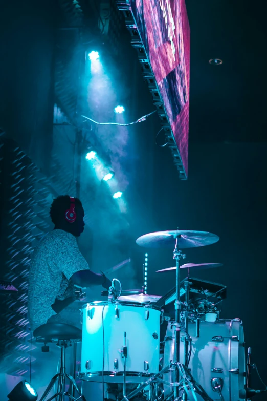 an electronic instrument is playing in front of lights