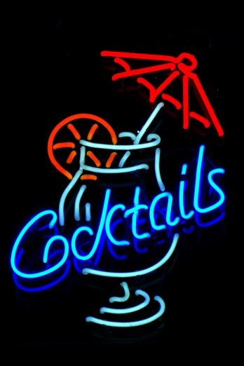 the neon signs are advertising cocktails in glass