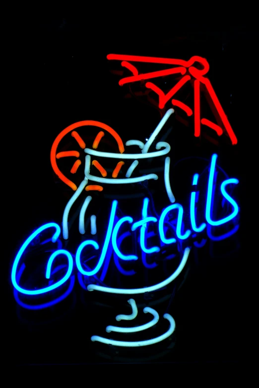 the neon signs are advertising cocktails in glass