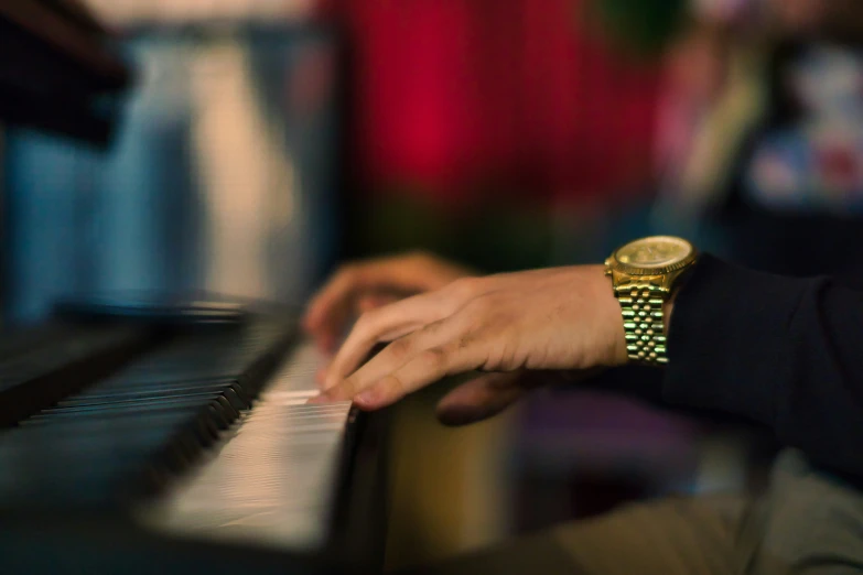 person sitting at a piano playing a video game