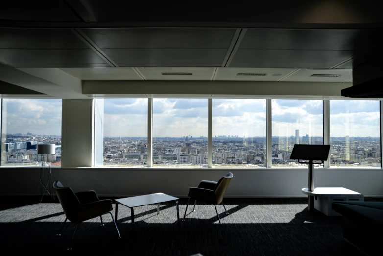 a black and white po of a window overlooking the city