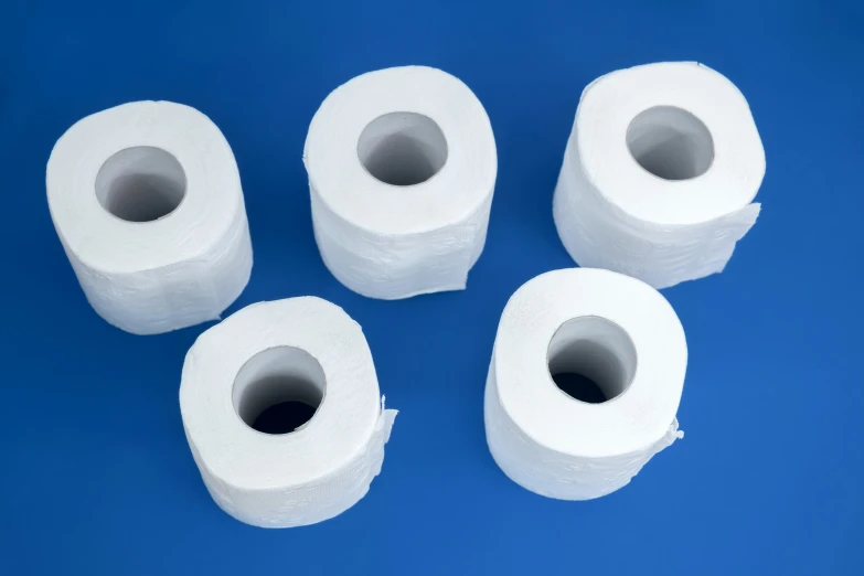 four toilet rolls sitting on top of each other