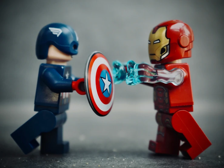 two lego figurines with captain america gear