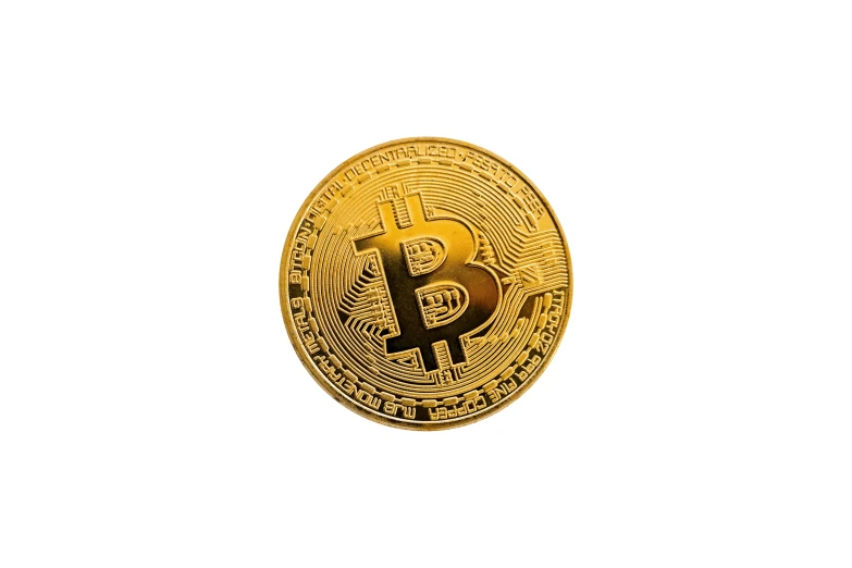 bitcoin is pictured on a white surface