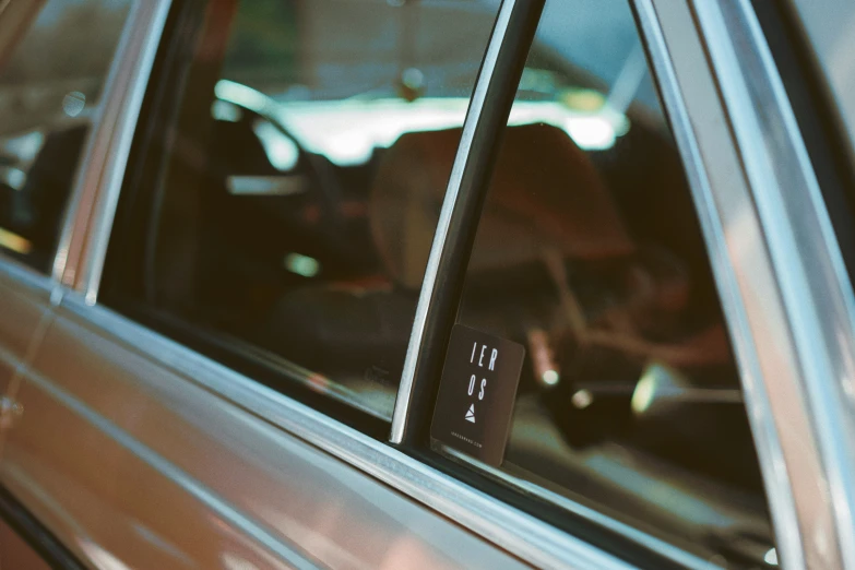 a parking sign is on a window of a car