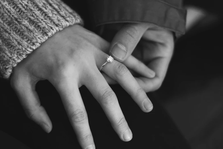 a couple holds hands while holding each other