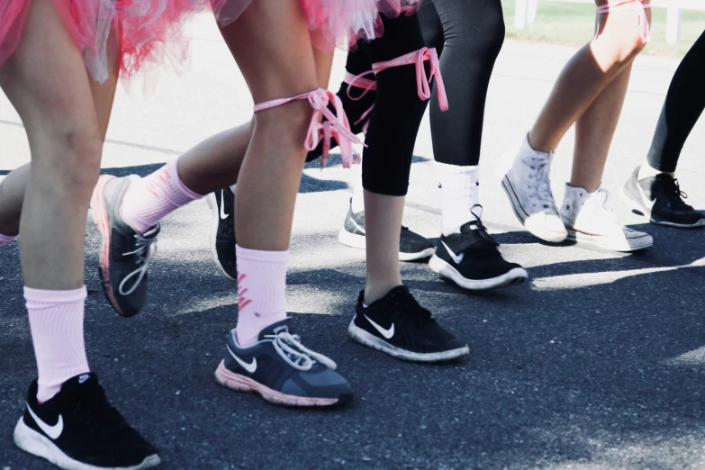 the feet and ankles of people wearing different colored socks