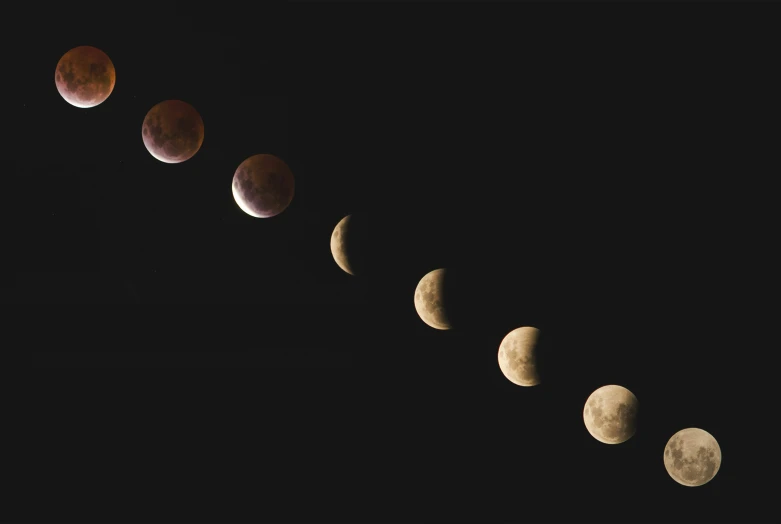 an array of eclipses, some moon in color