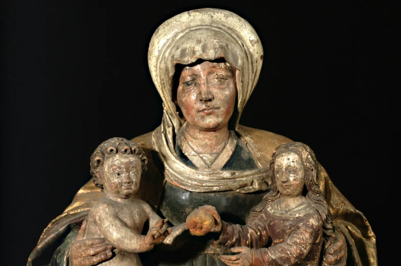 a statue of a virgin holding a boy
