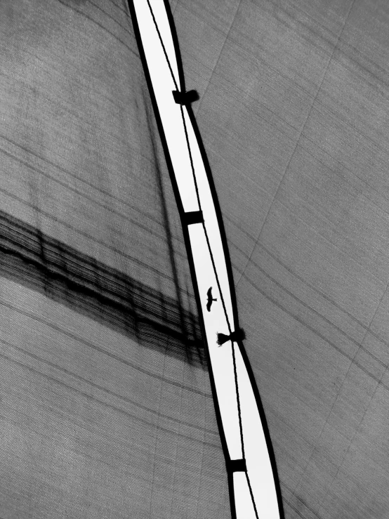 an aerial view shows a boat moving along the water