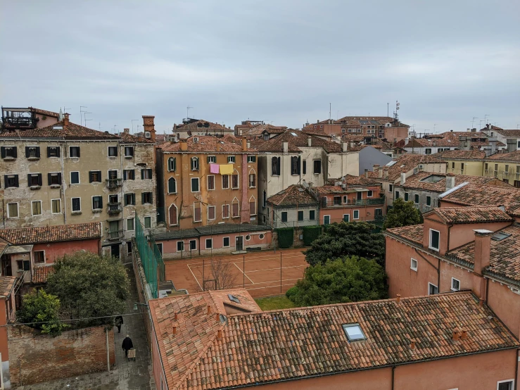 an overview of many old buildings and rooftops in a large city