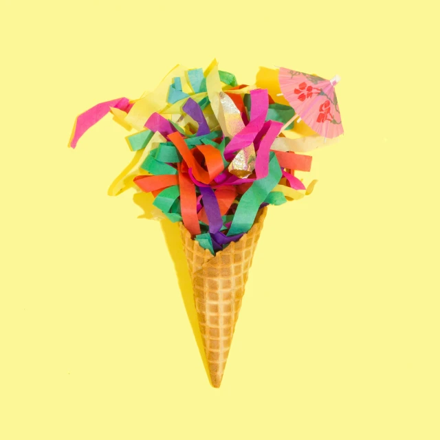 a ice cream cone with some colorful paper things on it