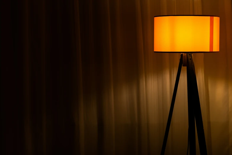 a lamp that is lit up in a room