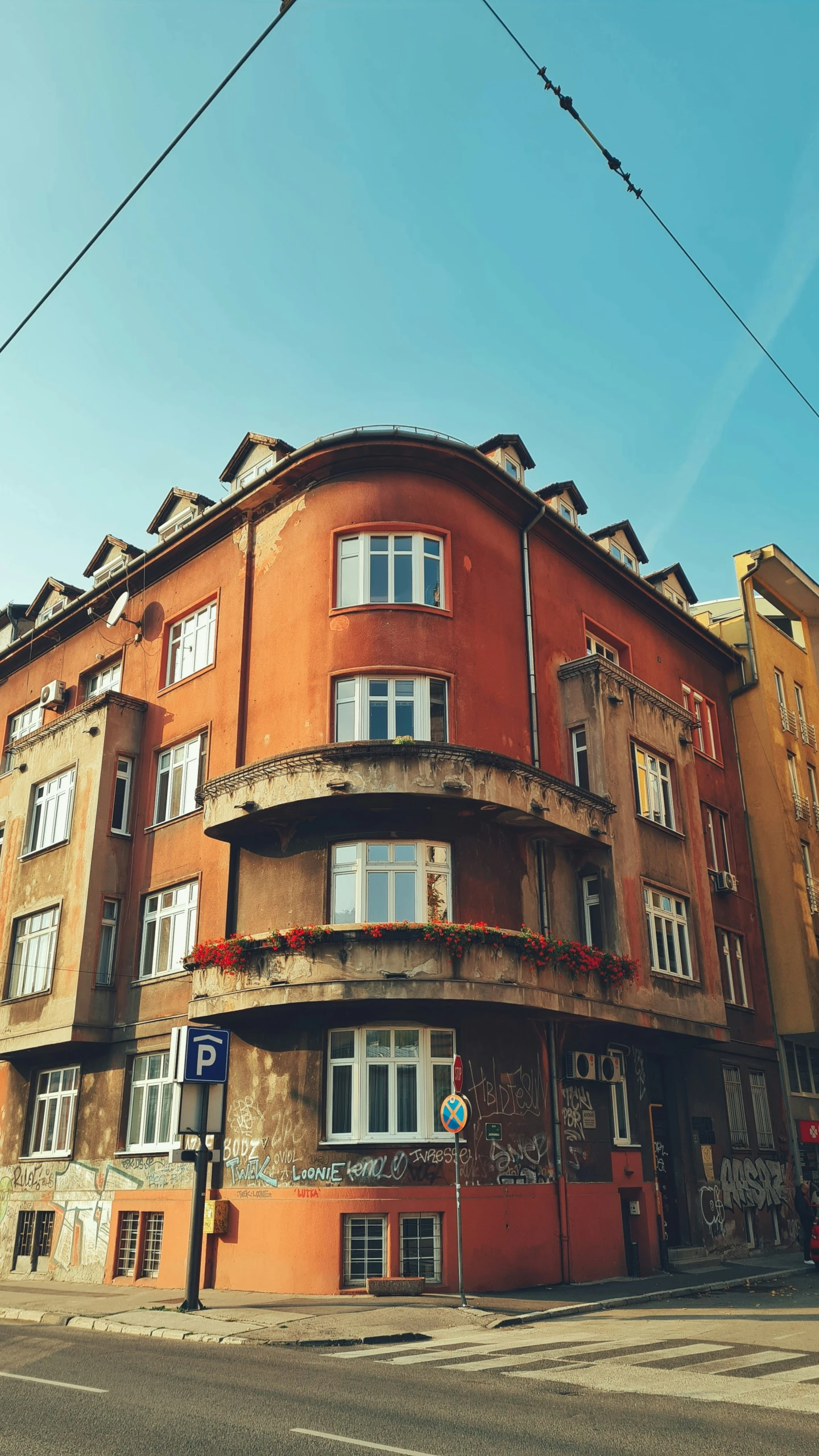 a building with many windows near a street light