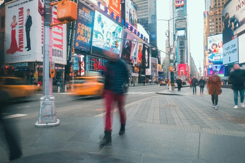 people walking in the busy city streets on a cold day