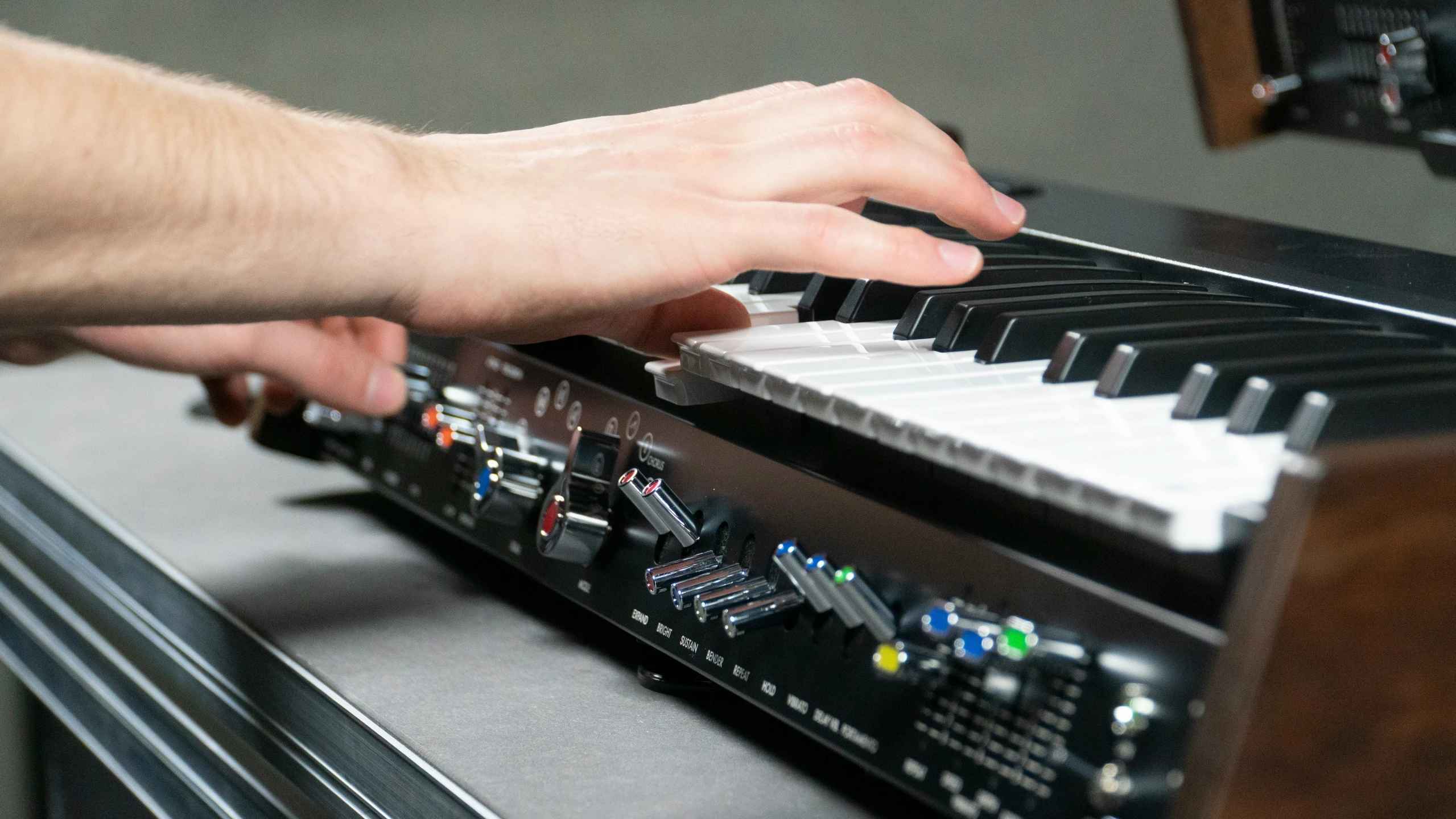 a person playing a piano near some other instruments