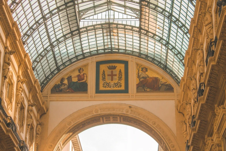 the top portion of a building with glass roof