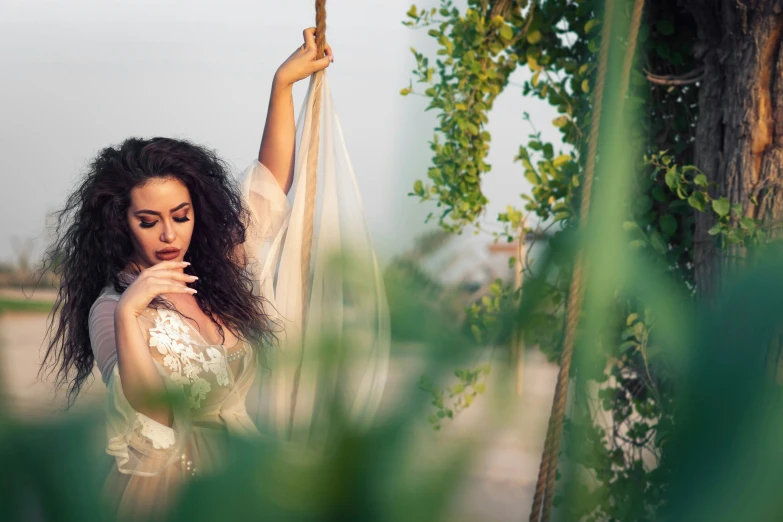 a woman holding on to a pole