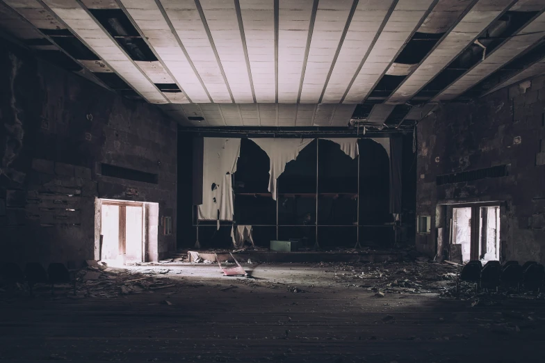 a run down building with debris on the floor