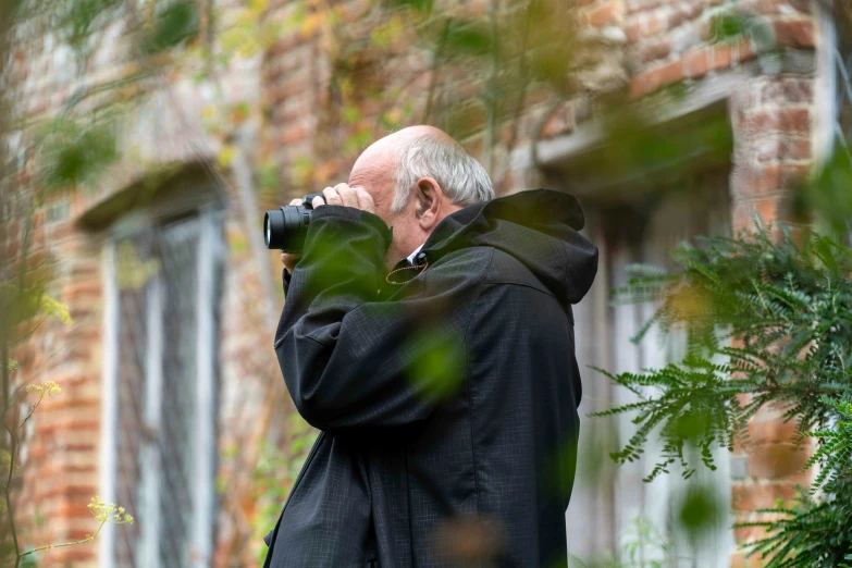 a man is taking pictures outside with his camera