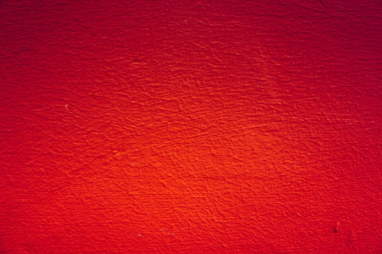 the top of a red wall with yellow lines