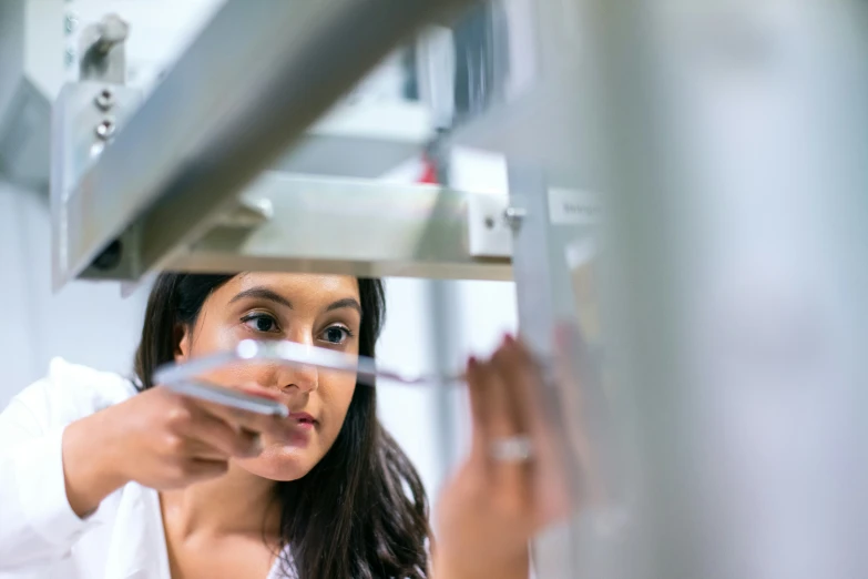 a woman checking soing on the machine