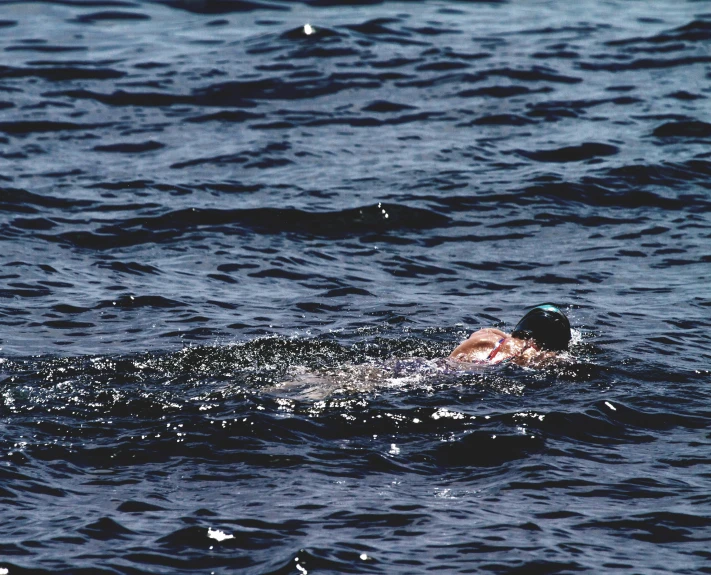 a person swims in the water at the same time