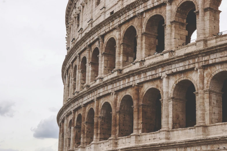 the side of a roman colossion on an overcast day