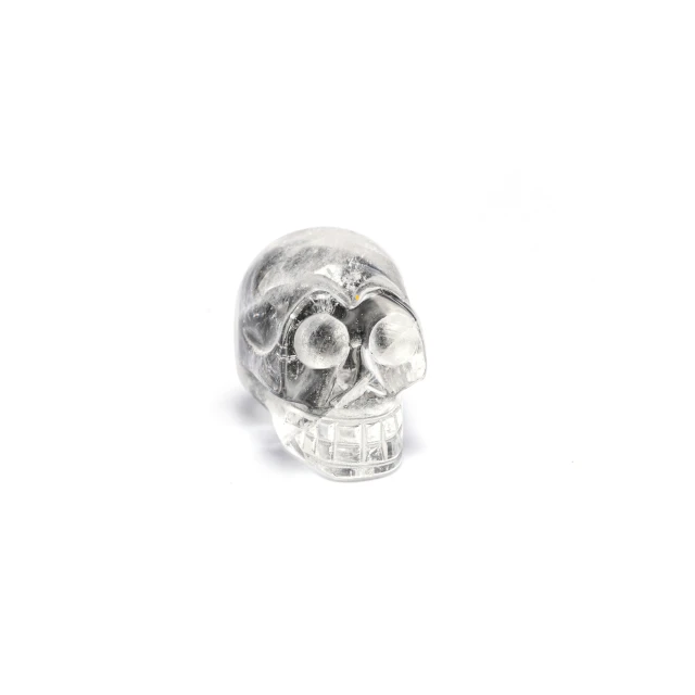 silver skull with three eyes and teeth